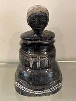 Front view of soapstone Inuit woman sculpture