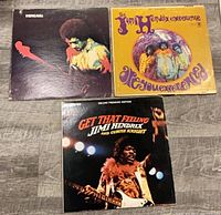 Top view of three Hendrix LP sleeves
