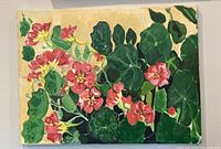 Full view of painting on wall showing flower and leaf composition