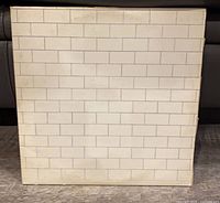 Front of gatefold sleeve showing white brick design