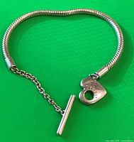 Full bracelet showing snake chain, heart end link and T-bar