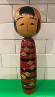 Full view of kokeshi doll front