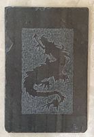 Front view of slate showing entire dragon engraving
