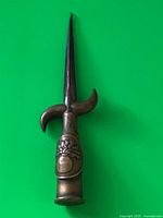 Full view of dagger showing blade, hilt, and handle