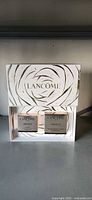 Closed white and gold Lancôme presentation box