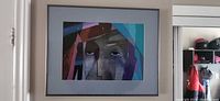 Framed print on wall showing full piece