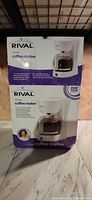 Front of sealed Rival 12-cup coffee maker box