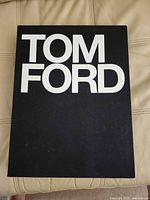 Front cover showing TOM FORD text on black cloth