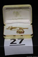 Pendant necklace displayed in Lundstrom box with lot number