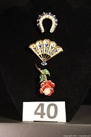 All three Trifari brooches shown together for scale