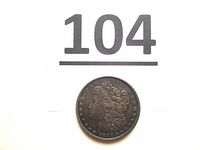 Obverse of 1897 Morgan dollar with lot number 104