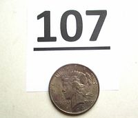 Obverse of 1924 Peace dollar next to lot number 107