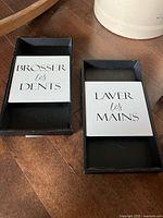 Both framed plaques front view showing text and frames