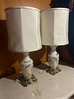 Both matching ceramic lamps with shades displayed together