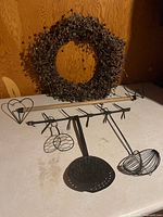 Overall lot showing wreath, towel rack, utensil rack and utensils