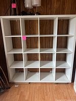 Front view of white 16-cube organizer showing all compartments