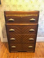 Full front view of dresser showing four drawers and decorative pulls