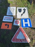 All seven signs laid out on ground