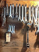 Wide view of hanging combination wrenches, various sizes
