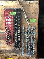 Overview of sockets on red, black and metal rails mounted to board