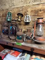 Shelf view of all lanterns showing quantity and varied styles