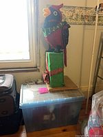 Cardinal decoration on storage bin showing overall size and condition