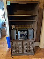 Full view of cabinet with stereo and speakers