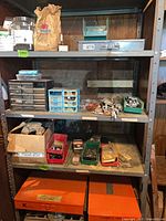 shelving unit with drawer organizers, bins and loose fasteners