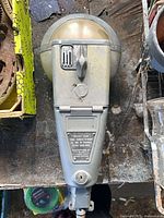 Front view showing coin slot, dome, instruction plate