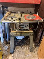 Makita table saw on stand with surface and frame visible