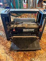 Front view showing Mastercraft branding, 12" planing width label and overall condition