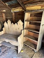 Bookcase and bench side by side in rustic shed setting