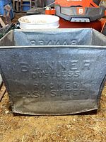 Embossed Banner dustless rocker ash sifter front view