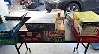 Multiple stacks of board games on table