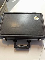 Closed black textured Bundy clarinet case