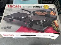 Aroma AHP-312 retail box showing product image and features