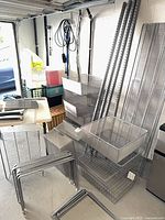 Overall view of Elfa components: mesh baskets, hang standards, shelves, feet