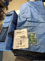 Canopy carry bag, manual, stake kit and folded canopy fabric