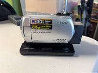 Front view of Sony DCR-SR42 camcorder on Handycam Station showing 40× zoom and 30 GB HDD labels