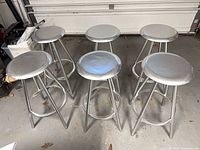 All six steel bar stools arranged in two rows