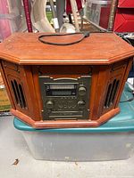 Front view showing wood cabinet, control panel, cassette door and speaker grilles
