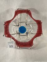 Top view showing overall form, six-lobed rim, blue center, bubble pattern