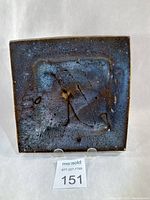 front view of square mottled blue stoneware dish