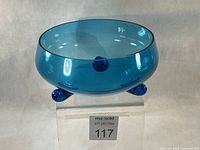 Full view of cobalt blue glass bowl on stand showing color and form