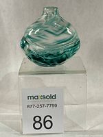 Front view of Pat Bavin glass vase showing green swirl design