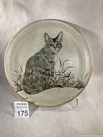 Front view showing full cat design and overall plate condition