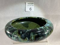 Angled view showing exterior glaze and rolled rim