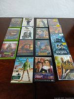 Overview of all video games and DVDs laid out on table