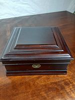 Closed wooden watch box top view