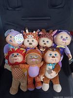 Group shot of all seven animal-costumed Cabbage Patch Kids plush dolls